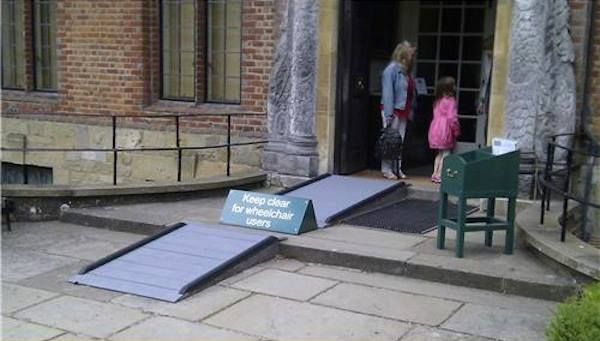 A small ramp has a sign halfway, blocking access. It says "keep clear for wheelchair users".