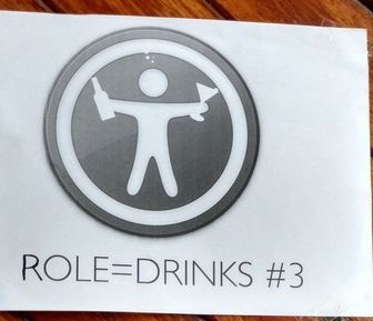 A crude poster on a wooden door. Apple's "Accessibility Guy" is holding a beer bottle and cocktail glass. Below it, "role=drinks #3".