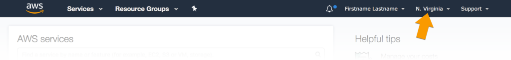 Screenshot of the AWS header navigation. An arrow annotation points out that the location is set to 'N. Virginia.'