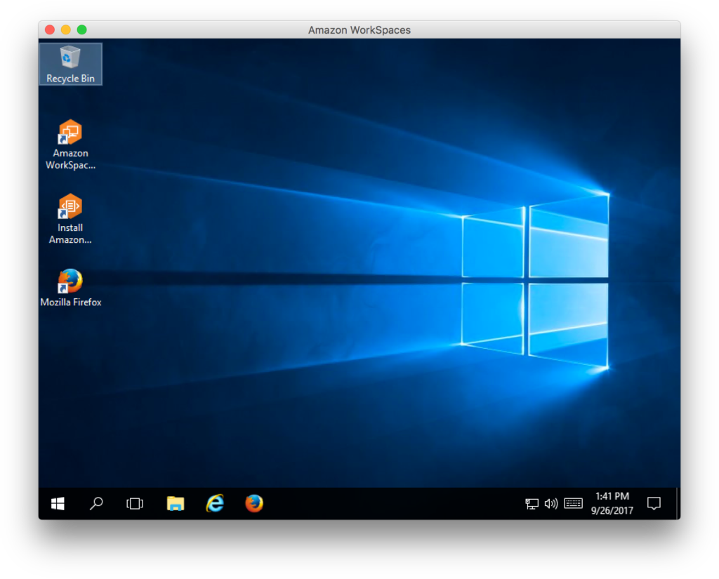 Screenshot of AWS WorkSpaces running Windows 10 in a macOS application window. The default configuration is displayed: the desktop contains a Recycle Bin, as well as shortcuts to Mozilla Firefox, Amazon WorkSpaces, and Install AWS Services. The desktop wallpaper prominently displays a stylized treatment of the Windows logo.